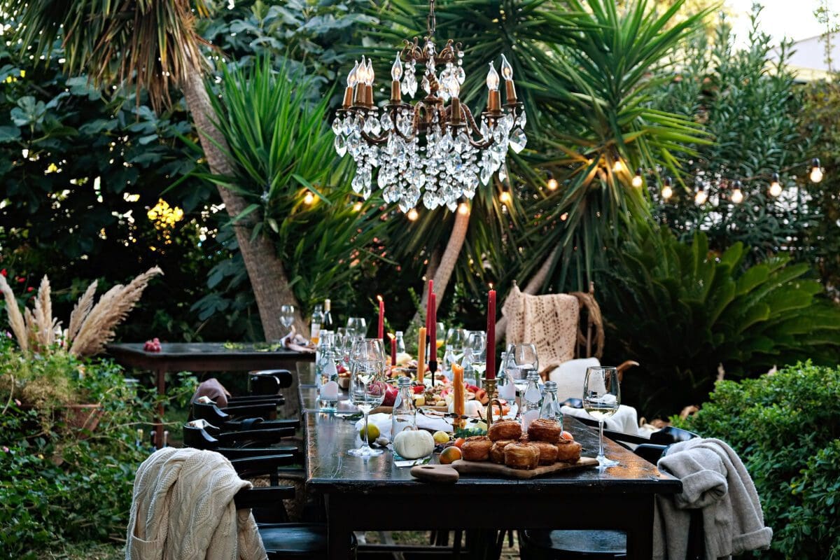 Banquet table setting and arrangement. Holiday table beautifully set with floral decoration. Beautiful event staged by Private Maui Chef.