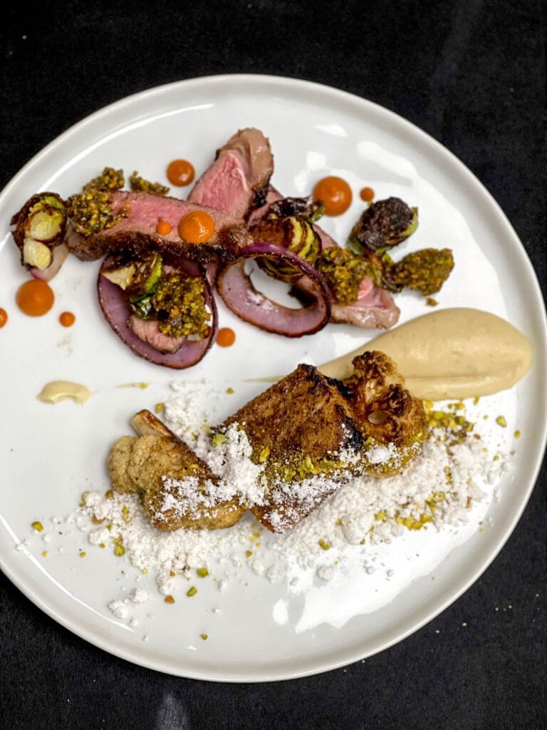 Surf and Turf of Ribeye and charred onion with mushroom dusted catch with truffles and pistachios