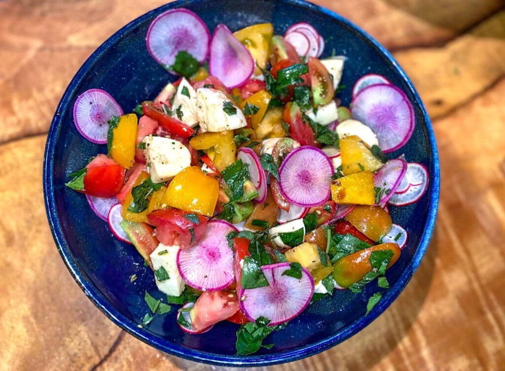 Summer tomato & burrata salad with radish & herbs