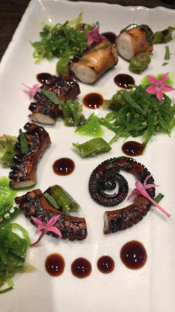 Ginger Scallion charred Tako, black garlic kabayaki, blistered shishito peppers, seaweed salad