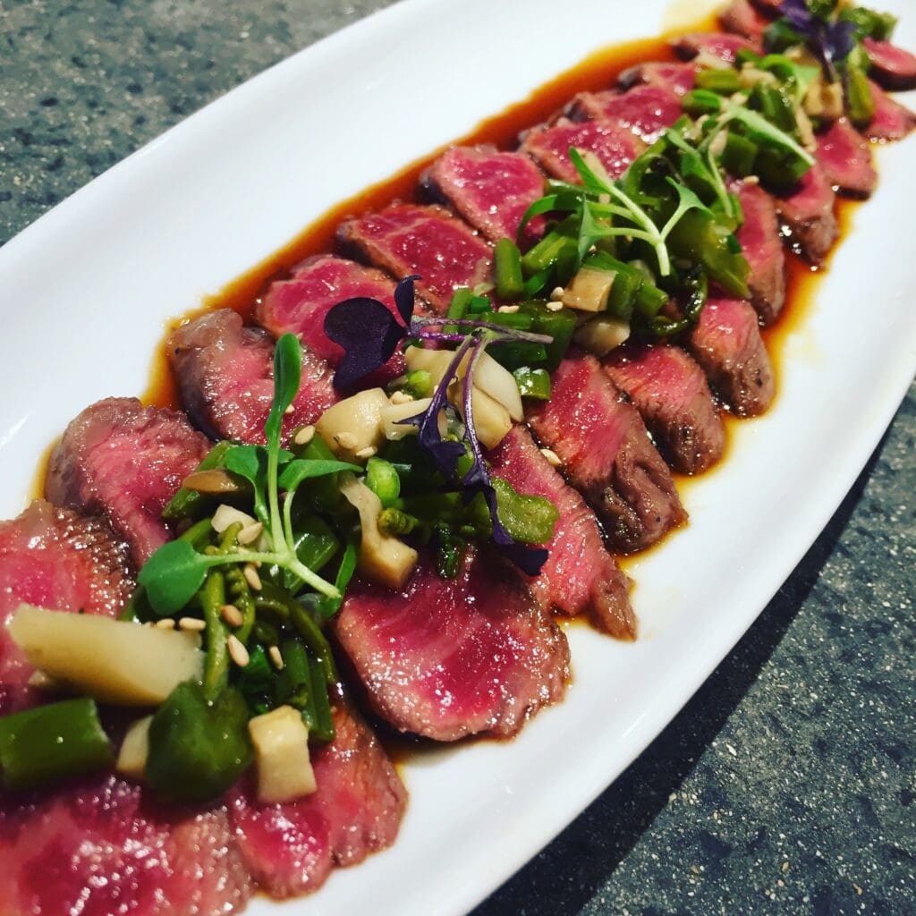Wagyu Tataki, pohole fern and Ali'i mushroom sunomono, chile ponzu, sesame